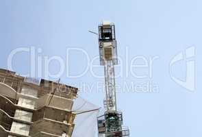 house develop with crane at day