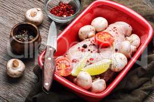 Raw chicken breasts and mushrooms