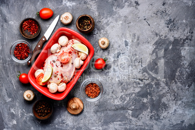 Raw chicken in baking dish