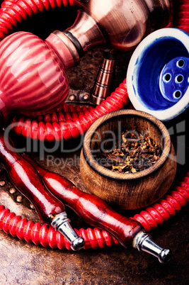 Smoking hookah with tobacco