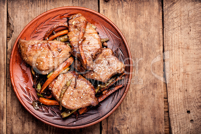 Beef steaks with vegetables