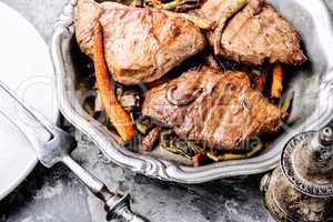 Beef steaks with vegetables