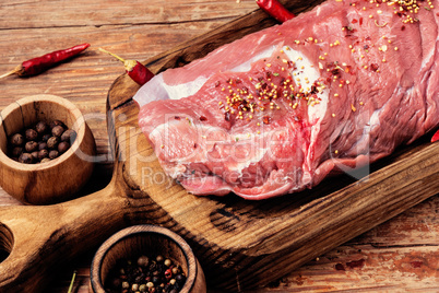 Raw fresh meat on wooden background