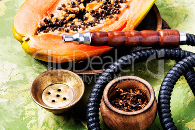 Smoking hookah with tobacco papaya