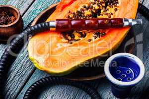 Smoking hookah with tobacco papaya