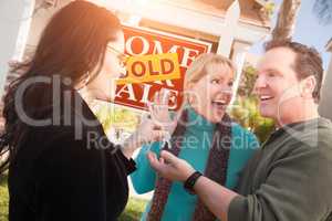 Hispanic Female Real Estate Agent Handing Over New House Keys