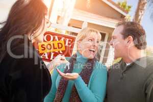 Hispanic Female Real Estate Agent Handing Over New House Keys