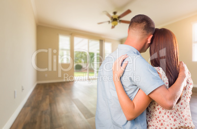 Young Military Couple Looking At Empty Room of New House