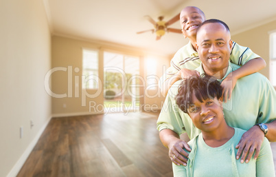 Happy African American Young Family In Empty Room of House