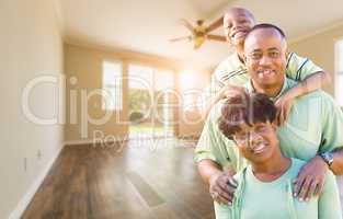 Happy African American Young Family In Empty Room of House