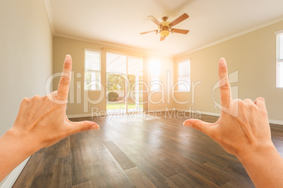 Female Hands Framing Empty Room of House