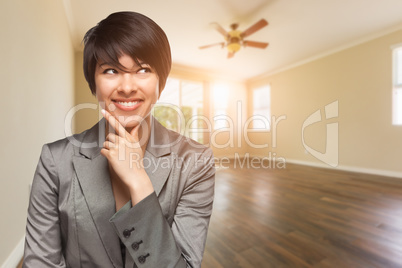 Mixed Race Young Adult Woman In Empty Room of House
