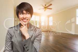 Mixed Race Young Adult Woman In Empty Room of House