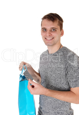 Happy man with shopping bag a credit card