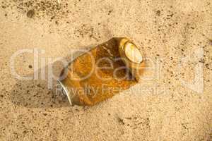 soda can on a beach