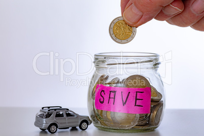 Car and glass with coins