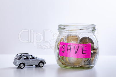 Car and glass with coins