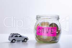 Car and glass with coins