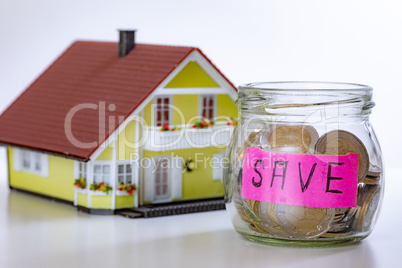 House and glass with coins