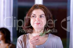 Woman with rosemary branch