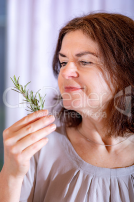 Woman with rosemary branch