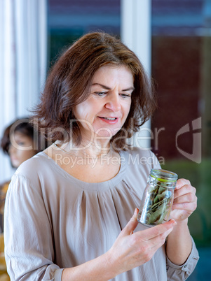 Woman with glass of spices