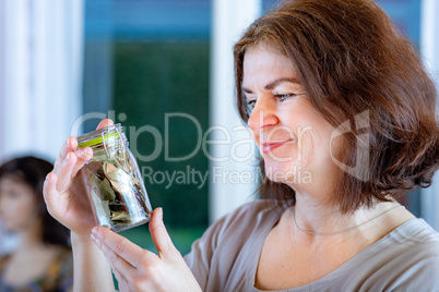 Woman with glass of spices