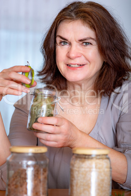 Woman with glass of spices