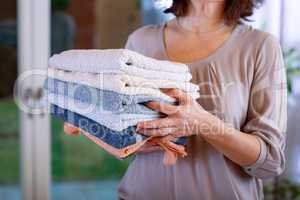 Woman carries towels