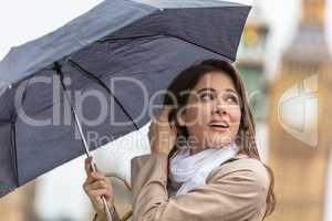 Woman Tourist With Umbrella by Big Ben, London, England