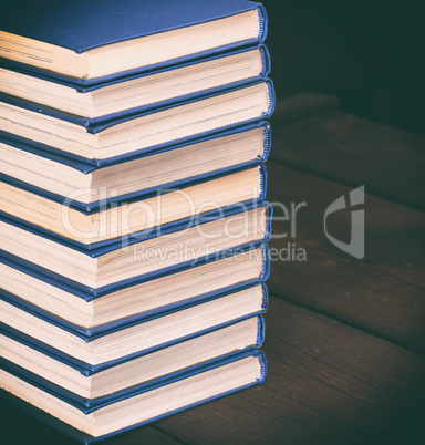 stack of books in a blue cover