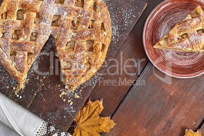 baked round apple pie and one cut piece