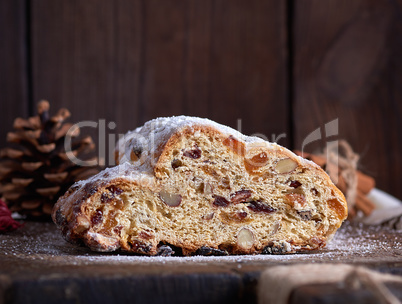 slice traditional European cake Stollen with nuts and candied fr