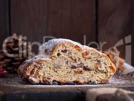 slice traditional European cake Stollen with nuts and candied fr