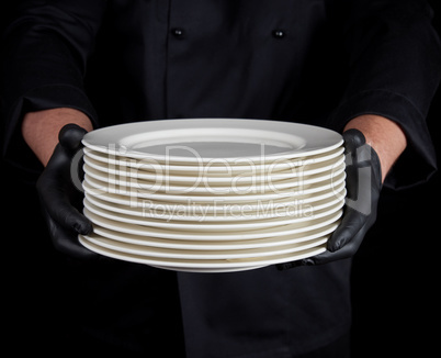 stack of round white empty plates