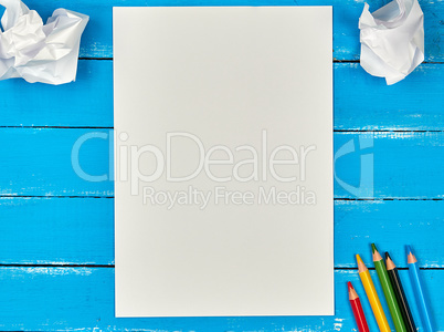 blank white rectangular sheet of paper and crumpled pieces of pa