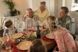 Family interacting with each other while having meal