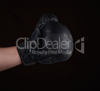 hand in black leather boxing glove