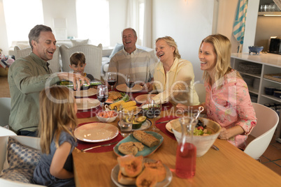 Family having meal on dining table