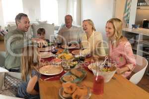 Family having meal on dining table