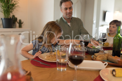 Father with their children having meal on dining table