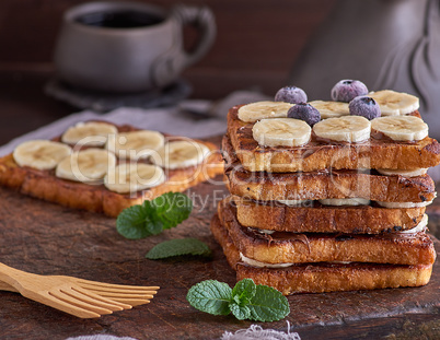 French toast on a brown wooden board