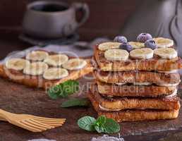 French toast on a brown wooden board
