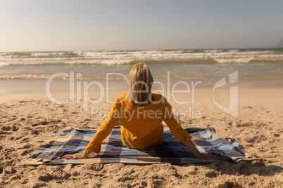 Senior woman looking at view on the beach