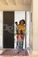 Happy African American family returning sweet home