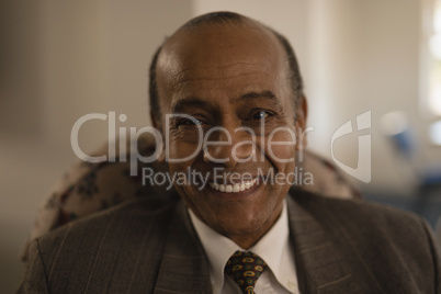 Close-up of senior man looking at camera in nursing home