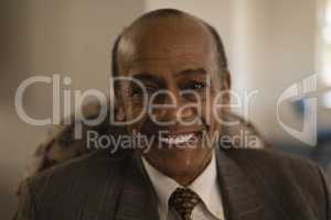 Close-up of senior man looking at camera in nursing home