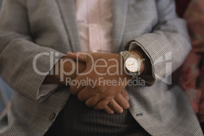 Senior man with folded hands at nursing home