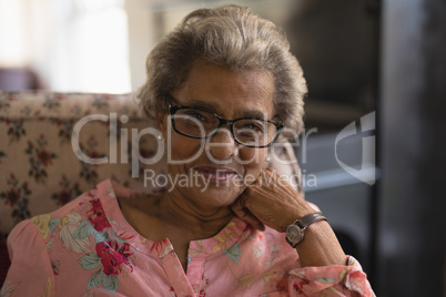 Front view of senior woman looking at camera in nursing home