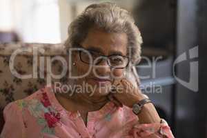 Front view of senior woman looking at camera in nursing home